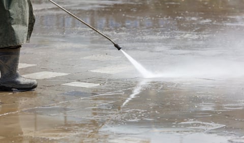 Water pressure washing driveway