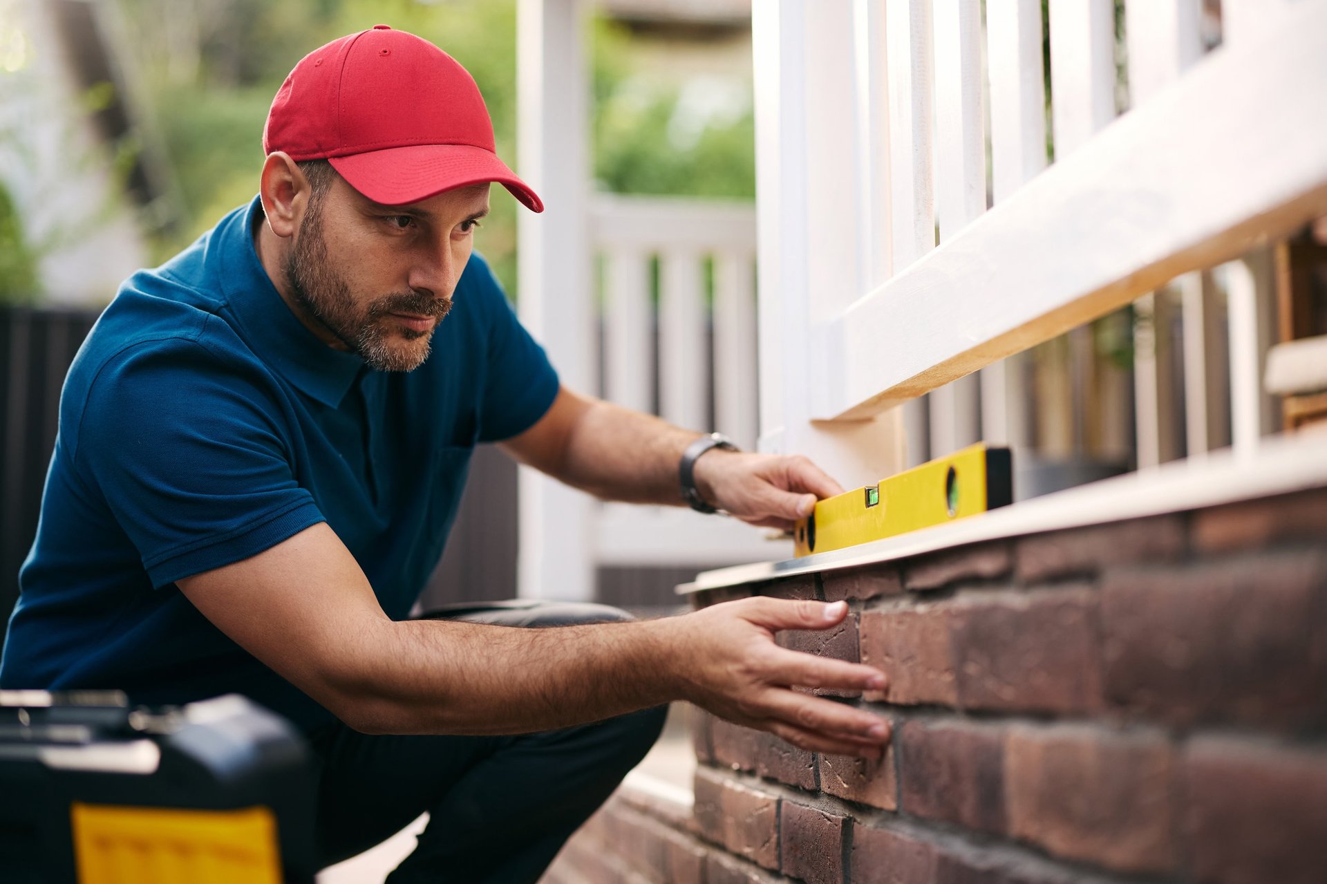 Construction worker repairing a porch - home renovation services